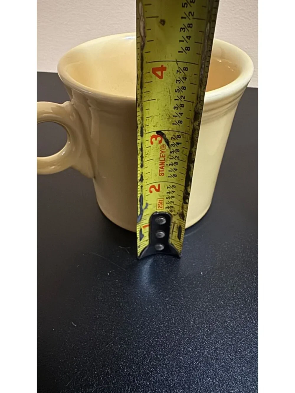 Pair of Fiesta Ware mugs in a light yellow glaze